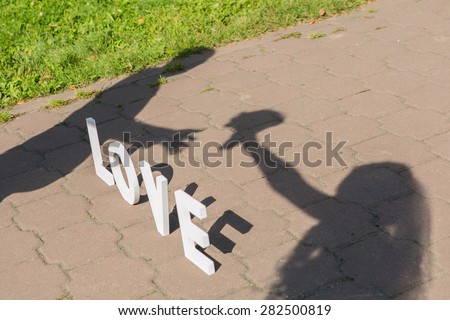 Shadows of love letters and just married couple