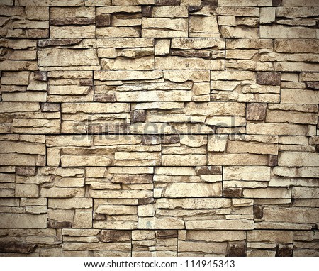 Grungy textured stone wall inside old neglected and deserted interior