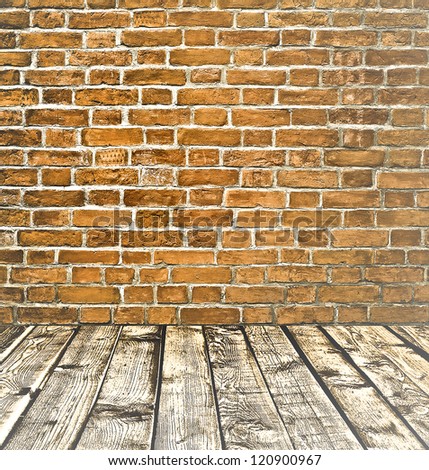 Empty old spacious room with stone grungy wall and wooden weathered dirty floor, vintage background texture of brickwall