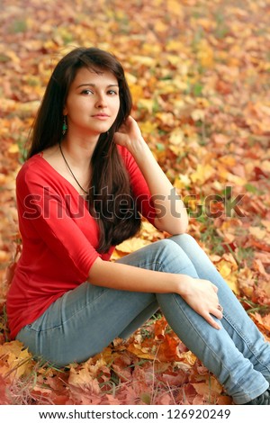 closeup portrait of pretty tender beautiful young female face with clear skin and delicate complexion in the autumn evening sunshine in nature