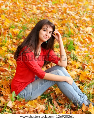 closeup portrait of pretty tender beautiful young female face with clear skin and delicate complexion in the autumn evening sunshine in nature