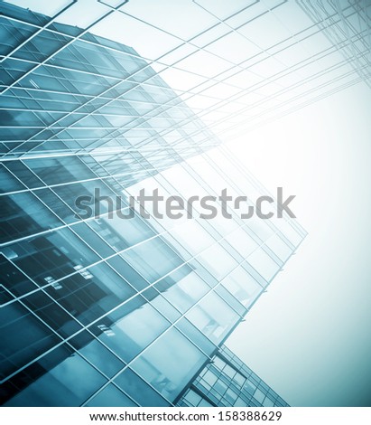 Panoramic and perspective wide angle view to steel blue background of glass high rise building skyscrapers in modern futuristic downtown at night Business concept of successful industrial architecture