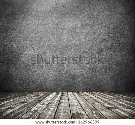 Grungy textured darken room and stone wall with warm brown wooden floor inside old neglected and deserted interior, masonry and carpentry brickwork concept