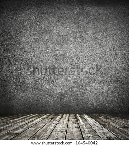 Grungy Textured Darken Room And Stone Wall With Warm Brown Wooden Floor Inside Old Neglected And Deserted Interior, Masonry And Carpentry Brickwork Concept