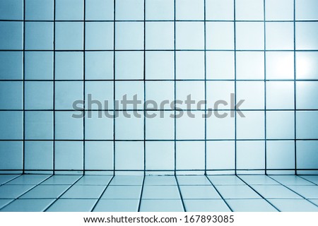 Background of beautiful modern turquoise luxury bathroom interior, blue glossy and clean ornamental stone tiled wall and floor in spacious domestic bath room and residential structure