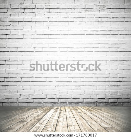 Grungy Textured White Brick And Stone Wall With Warm Brown Wooden Floor Inside Old Neglected And Deserted Interior, Masonry And Carpentry Brickwork Concept