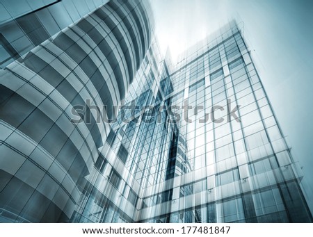 Panoramic And Perspective Wide Angle View To Steel Light Blue Background Of Glass Highrise Building Skyscraper, Modern Futuristic Commercial City Business Concept Of Successful Industrial Architecture