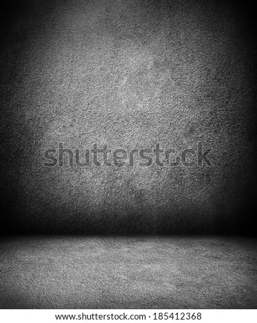 Abstract illustration background texture of an old weathered dark stucco black painted stone cement wall in rural room. Grungy cold rock surface in hard grime empty place with granite dull light floor