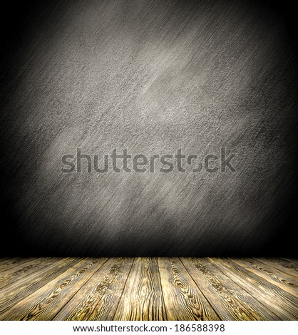 Background of age grungy black, white texture of paint stucco brick and stone wall with dark wood floor in old modern and contemporary empty interior, blank color horizontal space of clean studio room