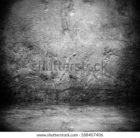 Abstract stonework background texture with old weathered dark stucco black paint stone cement wall in rural room Grungy cold rock surface in hard grime empty place with niello granite dull light floor