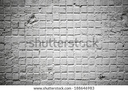 Abstract stonework background texture with old weathered dark stucco black paint stone cement wall in rural room Grungy cold rock surface in hard grime empty place with niello granite dull light floor