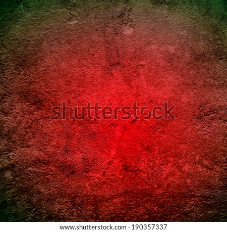 Abstract stonework background texture with old weathered dark stucco black paint stone cement wall in rural room. Grungy cold rock surface in hard grime empty place with red granite dull light floor.