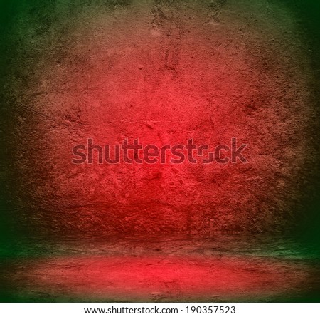Abstract stonework background texture with old weathered dark stucco black paint stone cement wall in rural room. Grungy cold rock surface in hard grime empty place with red granite dull light floor.
