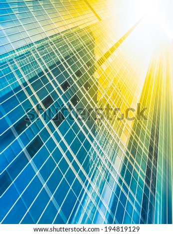 Panoramic and perspective wide angle view to steel light blue background of glass high rise building skyscraper commercial modern city of future. Business concept of successful industrial architecture