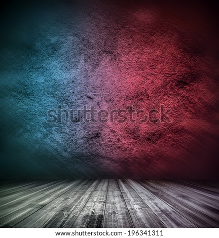 Abstract stonework background texture with old weathered dark stucco blue and red paint stone cement wall in rural room Grungy rock surface in hard grime empty place with wood panel light brown floor