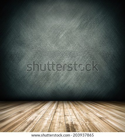 Abstract blank board background texture with old weathered dark stucco black paint stone cement wall in rural room Grungy cold rock surface in hard grime empty place with wood panel light brown floor