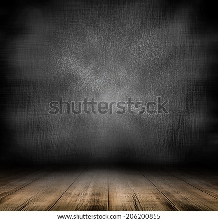 Abstract blank board background texture with old weathered dark stucco black paint stone cement wall in rural room Grungy cold rock surface in hard grime empty place with wood panel light brown floor