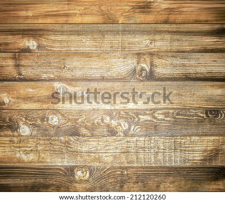 Background of brown old natural wood planks Dark aged empty rural room with tree floor pattern texture Closeup view to golden surface of retro pine logs inside vintage light warm interior with shadows