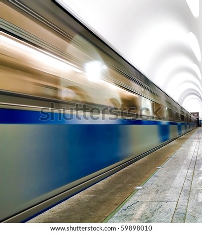 underground platform with moving train