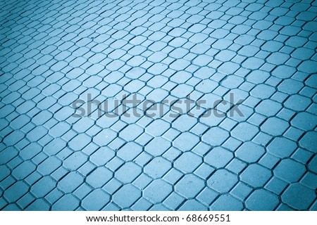 blue brickwork in the street, perspective view to sidewalk