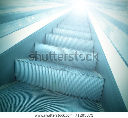 light steps of escalator in business center