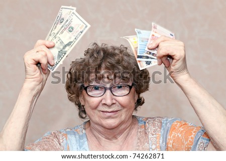 senior happy woman with money
