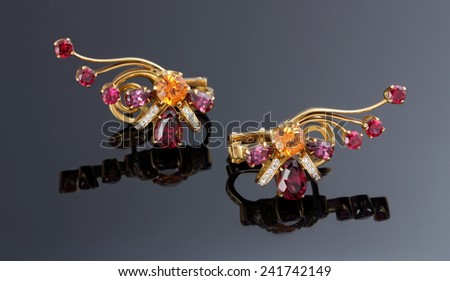 Earrings with pink and red jewelry stone