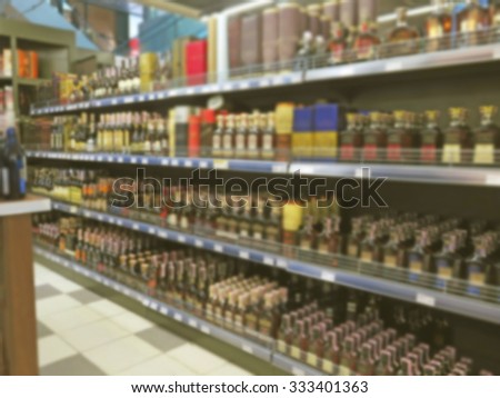 Abstract blurred image of interior with showcases and shelves in a department store with bokeh background