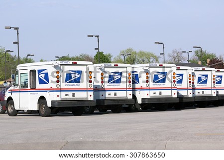 Franklin Park, Illinois / USA - May 7, 2015: A fleet of United States Postal Service (USPS) mail delivery vehicles await deployment in Franklin Park, Illinois.