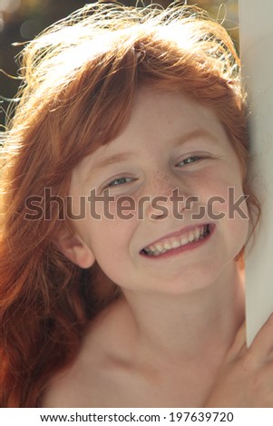 little red haired girl with back lighting