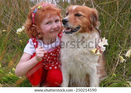 Red haired girl with red haired collie type sheep dog