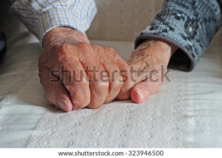Endless love, hands of two elderly