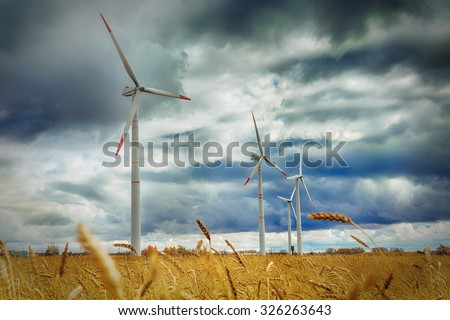 Wind Generator Turbines over Blue Sky - Green Renewable Energy