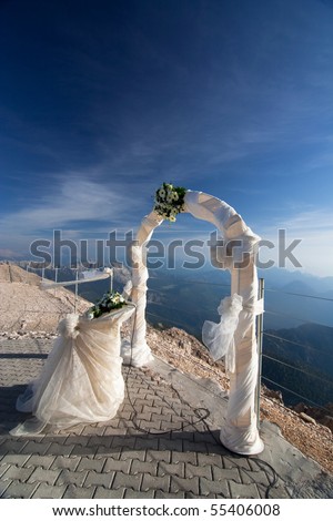stock photo Wedding arch against the blue sky
