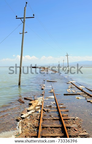 electric poles and rail in water during a spring floods