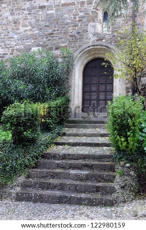 Steps and door in the medieval castle in the city of Udine in Italy in the fall on a gloomy day