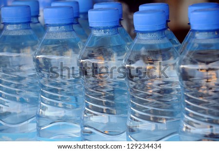 Closeup image of mineral water bottles in grocery store