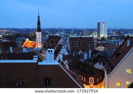 Late afternoon view of Tallinn in the winter with the City hall spire and Old city roofs