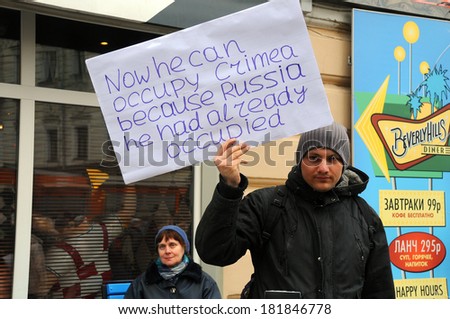 MOSCOW, RUSSIA - MARCH 15, 2014: Unidentified Russian young man during Moscow peace rally protests against Crimean referendum and further occupation of the peninsula