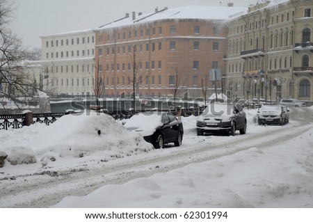 SAINT-PETERSBURG, RUSSIA - JANUARY 7: Car under snow in St.Petersburg on the day of the Russian Christmas January 7, 2010, Russia.