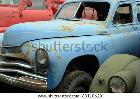 stock photo Rusty vintage cars in the graveyard in Russia