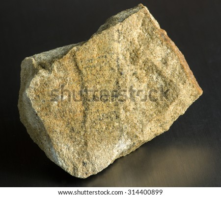 Mineral stone - sandstone. Most sandstone is composed of quartz and/or feldspar because these are the most common minerals in the Earth\'s crust.