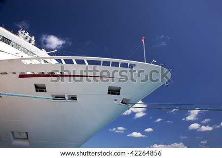 Front end of cruise ship docked at port of call