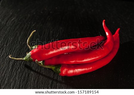 Red Chillies on a Slate Chopping Board