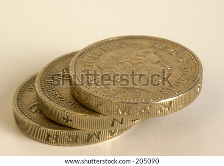 three pound coins on a white background