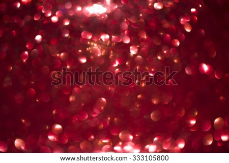 red and silver Sparkling Lights Festive background with texture. Abstract Christmas twinkled bright background with bokeh defocused lights and Falling stars. Winter background. Card or invitation.