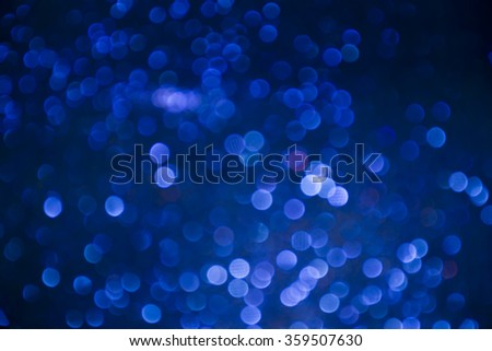 blue and silver Sparkling Lights Festive background with texture. Abstract Christmas twinkled bright background with bokeh defocused lights and Falling stars. Winter background. Card or invitation.