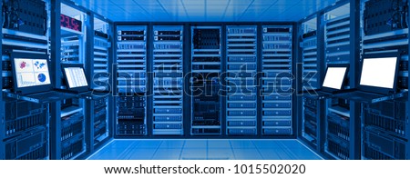 Data center room with server and networking device on rack cabinet, kvm monitor screen display chart, log and blank screen