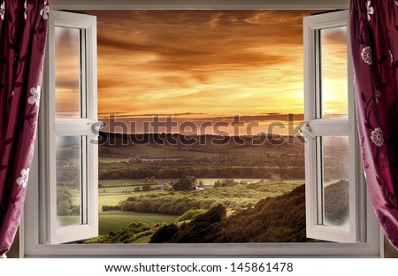 View Through An Open Window Onto Rural Landscape And Sunset
