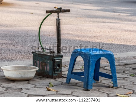 Basic equipment of enterprising fellow to repair or blow bicycle tires.